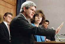 House Minority Whip Newt Gingrich, R-Ga., talks to reporters during a Capitol Hill news conference, Tuesday, April 25, 1989 in Washington as his wife, Marianne, looks on. Gingrich said he doesn’t feel snared by his trap, despite similarities between the ethics complaint brought against him ethics charges he instigated against House Speaker Jim Wright, D-Texas. (AP Photo/Dennis Cook)