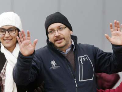 U.S. journalist Jason Rezaian gestures next to his wife Yeganeh Salehi as he poses for media people in front of Landstuhl Regional Medical Center in Landstuhl, Germany, Wednesday, Jan. 20, 2016. Rezaian was released from an Iranian prison last Saturday. (AP Photo by Michael Probst)