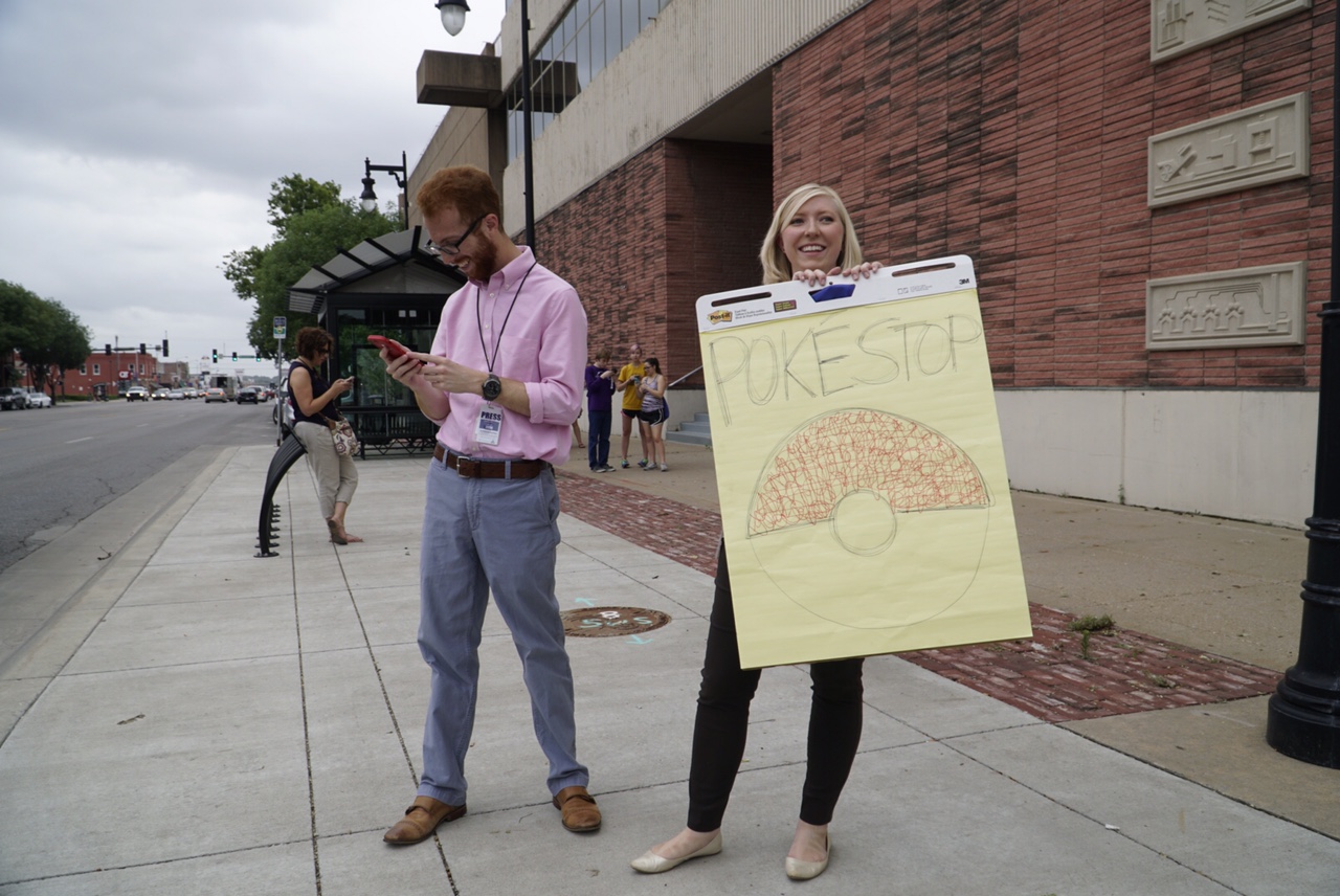 Wichita Eagle reporters Matt Riedl and Kelsey Ryan outside the paper on Tuesday trying to catch some engagement. (Photo by Jaime Green/Wichita Eagle)