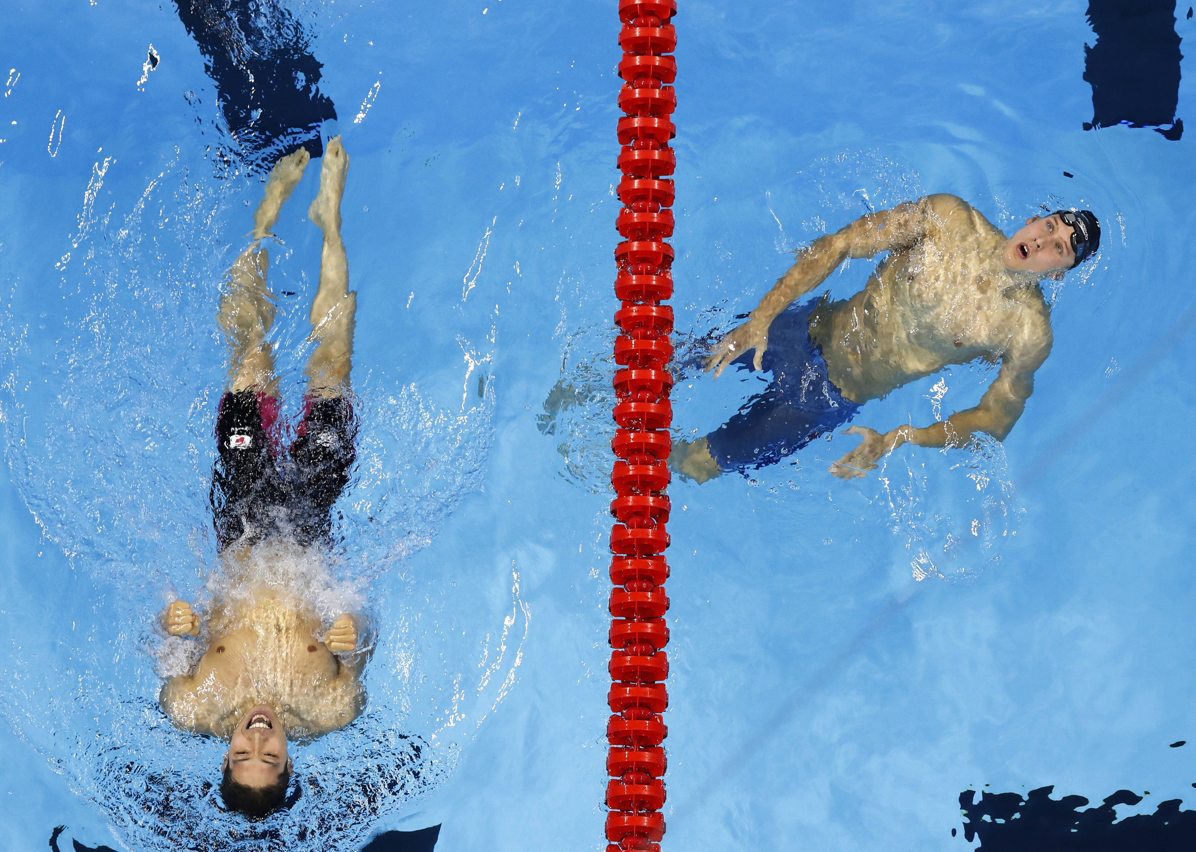 Japan's Kosuke Hagino, left, celebrates his gold medal win over USA's Chase Kalisz in the 400m individual medley swimming competition at the 2016 Summer Olympics, Saturday, Aug. 6, 2016, in Rio de Janeiro, Brazil. (AP Photo/Morry Gash)