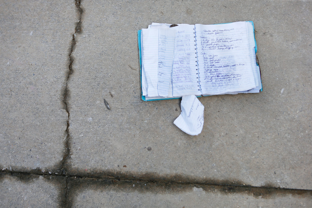 A notebook full of handwritten family recipes set out to dry on the driveway at the home of Earl and Julie Hebert in Denham Springs on Wednesday, Aug. 17. The area had several feet of water during the historic flood this week. (Photo by Chris Granger, Nola.com | The Times-Picayune)
