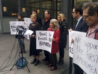 Rep. Carolyn Maloney, D-NY, foreground left, addresses the media in front of the New York Times offices, Saturday, Feb. 25, 2017 in New York.  Maloney voiced outrage over the White House decision to block The New York Times, the Los Angeles Times, CNN, Politico and others from a press briefing in Washington on Feb. 24. (AP Photo/Julie Walker)