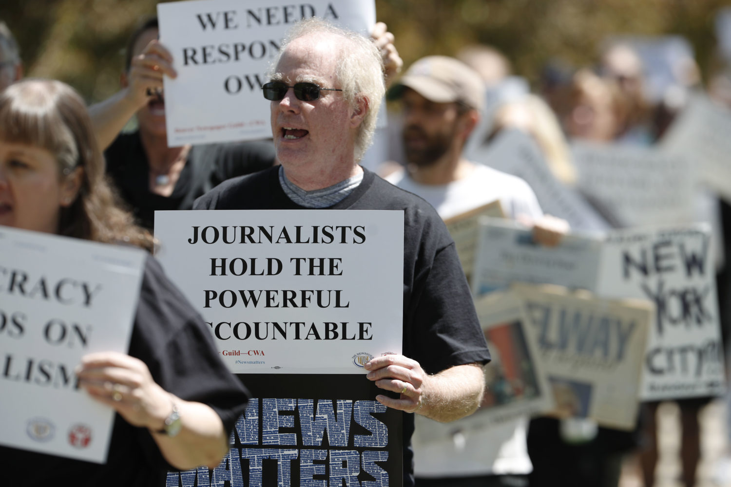 Gene Forbes, who works in the pre-press department of The Denver Post, walks with fellow employees during a rally against the paper's ownership group, Alden Global Capital, Tuesday, May 8, 2018, outside the paper's office and printing plant in north Denver. Members from all guild units were on hand in Denver for the rally at which they urged Alden Capital to invest in the newspapers that it controls or sell the properties. (AP Photo/David Zalubowski)