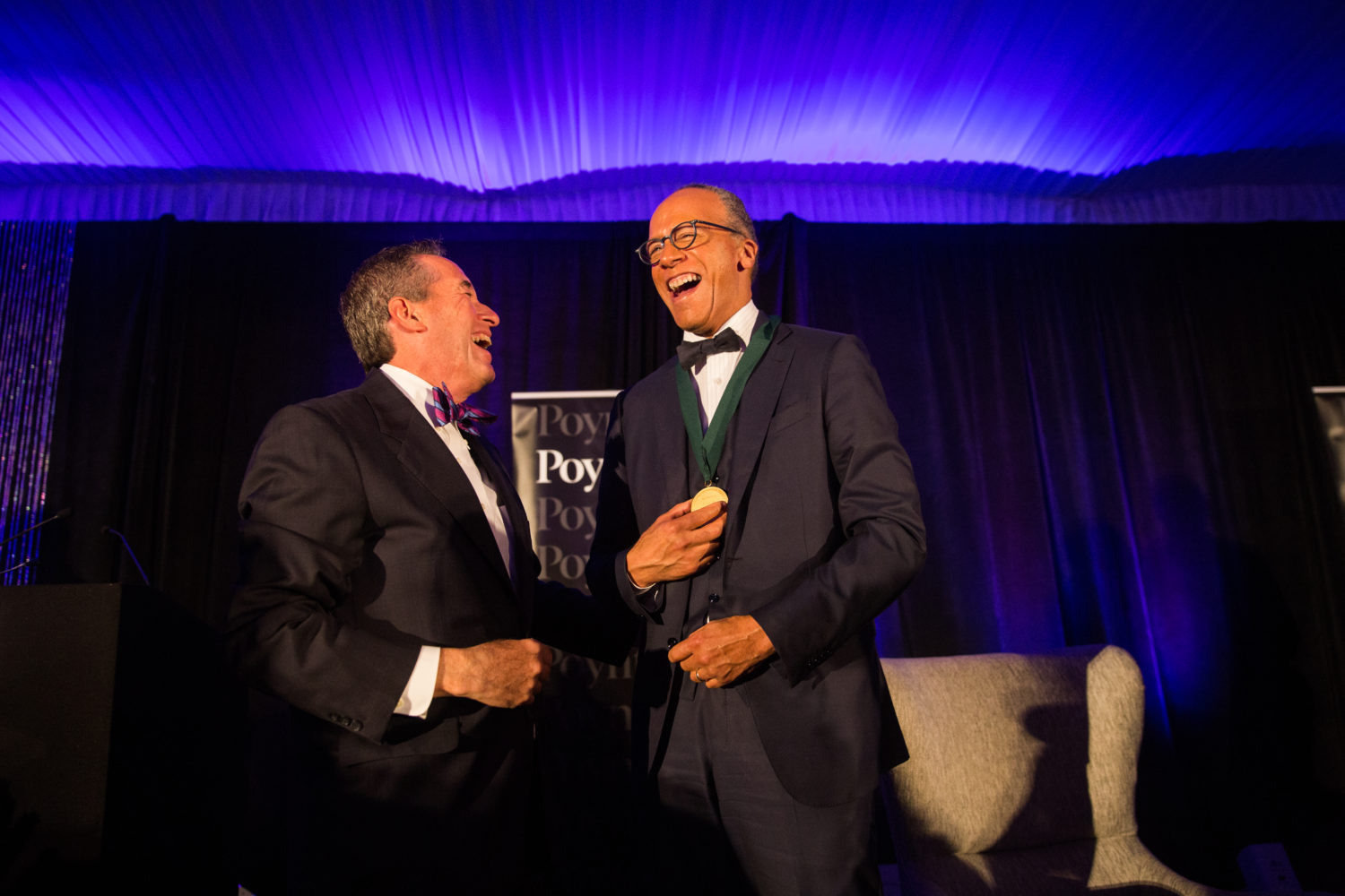 Poynter President Neil Brown (left) laughs with "NBC Nightly News" anchor Lester Holt at the fourth annual Bowtie Ball. (Photo by Chris Zuppa)