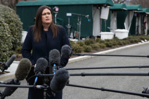 White House press secretary Sarah Huckabee Sanders listens to a question as she speaks with reporters outside the White House, Wednesday, Jan. 23, 2019, in Washington. (AP Photo/ Evan Vucci)