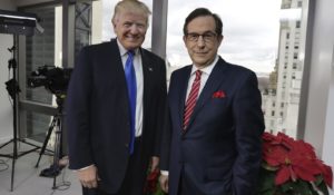 Then-President-elect Donald Trump poses for a photo with Chris Wallace before his interview for "Fox News Sunday" at Trump Tower in 2016. (AP Photo/Richard Drew)