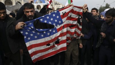 Protesters burn a U.S. flag during a demonstration over the U.S. airstrike in Iraq that killed Iranian Revolutionary Guard Gen. Qassem Soleimani. (AP Photo/Vahid Salemi)