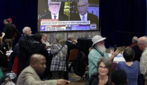 Supporters of Democratic presidential candidate Sen. Amy Klobuchar, wait for the caucus results to be released Monday night. (AP Photo/Nati Harnik)