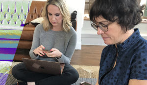 Emily Ramshaw works on the floor with The 19th’s chief revenue officer, Johanna Derlega, during the early start-up days. (Credit: 19th editor-at-large Errin Haines/Sara O’Brien)