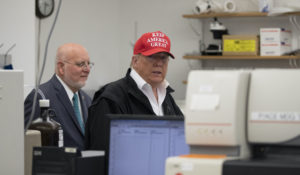 President Donald Trump arrives with Robert Redfield, director of the Centers for Disease Control and Prevention, at the CDC’s headquarters in Atlanta Friday. (AP Photo/Alex Brandon)