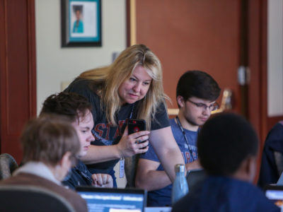 Barbara Allen, director of college programming for Poynter, works with students in the MediaWise Voter Project Campus Correspondent program. (Chris Zuppa for Poynter)