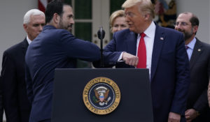 LHC Group's Bruce Greenstein elbow bumps with President Donald Trump during a news conference about the coronavirus in the Rose Garden at the White House, Friday, March 13, 2020, in Washington. (AP Photo/Evan Vucci)