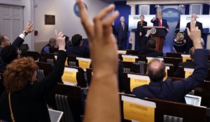 Reporters raise their hands to ask a question of President Donald Trump during a briefing on the coronavirus last week. (AP Photo/Alex Brandon)