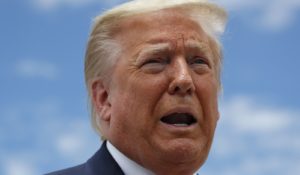 President Donald Trump speaks to the media as he boards Air Force One. (AP Photo/Alex Brandon)