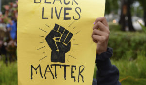 A protestor in Coral Springs, Florida. (Credit: mpi04/MediaPunch /IPX)