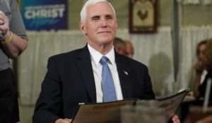 Vice President Mike Pence waits to order during a lunch stop in Forest City, Iowa on Tuesday. (AP Photo/Charlie Neibergall)