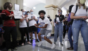 Black Lives Matter protesters rally at the Statehouse in Des Moines, Iowa, in June. Young journalists may balk at the idea that race and gender identity are political issues, since many emerging journalists consider “political” issues simply the facts of their existence. (AP Photo/Charlie Neibergall)