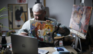 Fred Haag, an associate professor of visual arts at Penn State York, shows how to mix colors during his Art 50: Introduction to Painting course from a loft studio at his small farm in Hellam, Pennsylvania. (AP Photo/Matt Slocum)