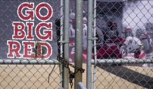 Gates leading into Memorial Stadium are padlocked in Lincoln, Nebraska. The Big Ten won't play football this fall because of concerns about COVID-19. (AP Photo/Nati Harnik)