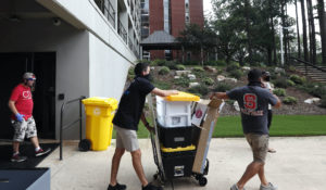 College students move in for the fall semester at N.C. State University in Raleigh, N.C., Friday, July 31, 2020. (AP Photo/Gerry Broome)