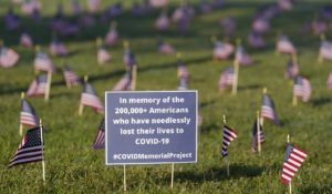 Activists from the COVID Memorial Project mark the deaths of 200,000 lives lost in the U.S. to COVID-19. (AP Photo/J. Scott Applewhite)