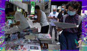 People queue up at a news stand to buy copies of Apple Daily at a downtown street in Hong Kong Tuesday, Aug. 11, 2020, as a show of support, a day after the arrest of its founder Jimmy Lai. Hong Kong authorities arrested media tycoon Jimmy Lai on Monday, broadening their enforcement of a new national security law and stoking fears of a crackdown on the semi-autonomous region's free press. (AP Photo/Vincent Yu/Sara O'Brien)