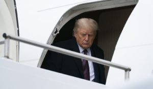 President Donald Trump arrives at Morristown (N.J.) Municipal Airport to attend a fundraiser on Thursday. (AP Photo/Evan Vucci)