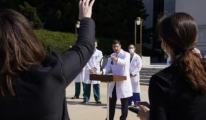 Dr. Sean Conley, physician to President Donald Trump, briefs reporters at Walter Reed National Military Medical Center on Sunday. (AP Photo/Jacquelyn Martin)