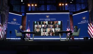 President-elect Joe Biden and Vice President-elect Kamala Harris listen during a meeting with Biden's COVID-19 advisory council on Monday. (AP Photo/Carolyn Kaster)