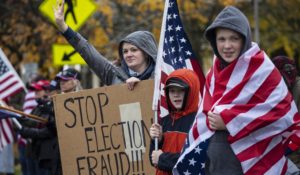 Supporters of President Trump hold signs as they attend a "Stop The Steal" rally in Salem, Oregon last weekend. (AP Photo/Paula Bronstein)