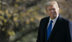 President Donald Trump walks on the South Lawn of the White House on Sunday. (AP Photo/Patrick Semansky)