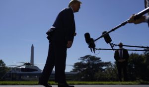 President Donald Trump listens to a reporter's question as he speaks with members of the press on the South Lawn of the White House in October. (AP Photo/Patrick Semansky)