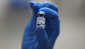 A nurse holds a phial of the Pfizer-BioNTech COVID-19 vaccine at Guy’s Hospital in London, Tuesday, Dec. 8, 2020. (AP Photo/Frank Augstein, Pool)