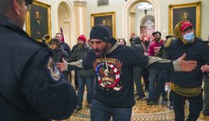 Trump supporters gesture to U.S. Capitol Police in the hallway outside of the Senate chamber at the Capitol in Washington on Wednesday. (AP Photo/Manuel Balce Ceneta, File)