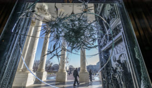 Shattered glass from last week's attack on Congress by a pro-Trump mob is seen in the doors leading to the Capitol Rotunda, in Washington, Tuesday, Jan. 12, 2021.  (AP Photo/J. Scott Applewhite)