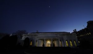 The moon rises over the West Wing of the White House on President Donald Trump's last day in office. (AP Photo/Gerald Herbert)