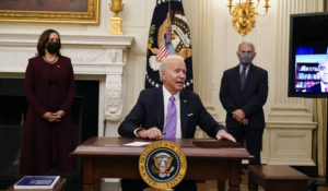 President Joe Biden responds to a reporter's question after signing executive orders in the State Dinning Room of the White House, Thursday, Jan. 21, 2021, in Washington. (AP Photo/Alex Brandon)