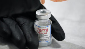 University of Pittsburgh Pharmacy student Edith Wang loads a syringe with a dose of the Moderna COVID-19 vaccine. (AP Photo/Gene J. Puskar)