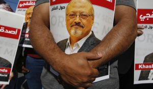 People hold posters of slain Saudi journalist Jamal Khashoggi near the Saudi Arabia consulate in Istanbul in 2020. (AP Photo/Emrah Gurel)