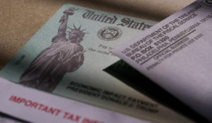 A stimulus check issued by the IRS to help combat the adverse economic effects of the COVID-19 outbreak is seen in San Antonio, Thursday, Jan. 28, 2021. (AP Photo/Eric Gay)