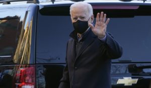 President Joe Biden waves as he arrives at Holy Trinity Catholic Church in Washington on Saturday. (AP Photo/Patrick Semansky)