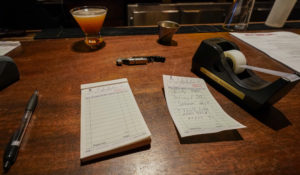 A to-go order is seen on the bar in the Hell's Kitchen neighborhood of New York. The CDC has published a case study about how a rural bar in Illinois became ground zero of a 46-person COVID-19 outbreak after patrons gathered there. (AP Photo/Mary Altaffer)