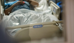 An inmate from a nearby prison is shackled to the bed as he is treated with a ventilator for COVID-19 inside the intensive care unit at Kent Hospital, Monday, Dec. 28, 2020, in Warwick, R.I. (AP Photo/David Goldman)