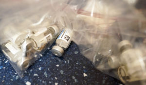 Empty vials of the Johnson & Johnson's one-dose COVID-19 vaccine are seen at the Vaxmobile, at the Uniondale Hempstead Senior Center, Wednesday, March 31, 2021, in Uniondale, N.Y.   (AP Photo/Mary Altaffer)
