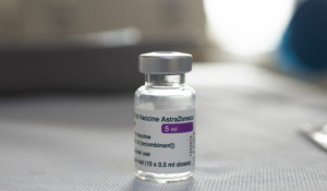 A vial of AstraZeneca vaccine against COVID-19 sits on a general practitioner's table in Amsterdam, Netherlands, Wednesday, April 14, 2021. (AP Photo/Peter Dejong)