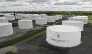 Colonial Pipeline storage tanks are seen in Woodbridge, N.J., Monday, May 10, 2021. Gasoline futures are ticking higher following a cyberextortion attempt on the Colonial Pipeline, a vital U.S. pipeline that carries fuel from the Gulf Coast to the Northeast. (AP Photo/Ted Shaffrey)