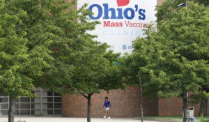 A man walks to the entrance for Ohio's COVID-19 mass vaccination clinic at Cleveland State University, Tuesday, May 25, 2021, in Cleveland. Nearly 2.8 million residents have registered for Ohio's Vax-a-Million vaccination incentive program, Gov. Mike DeWine announced Monday, May 24. (AP Photo/Tony Dejak)