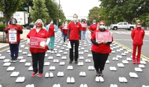 National Nurses United honors the hundreds of registered nurses who lost their lives caring on the front line of COVID-19 in front of The White House on Wednesday, May 12, 2021, in Washington, DC. (Paul Morigi/AP Images for National Nurses United)