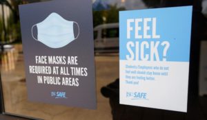 Face mask requirements are posted at the various entrances at the Rose E. McCoy Auditorium where COVID-19 vaccinations are being offered on the Jackson State University campus in Jackson, Miss. (AP Photo/Rogelio V. Solis)