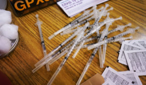 Prepared Pfizer COVID-19 vaccine syringes at London Middle School in Wheeling, Ill., Friday, June 11, 2021.  (AP Photo/Nam Y. Huh)